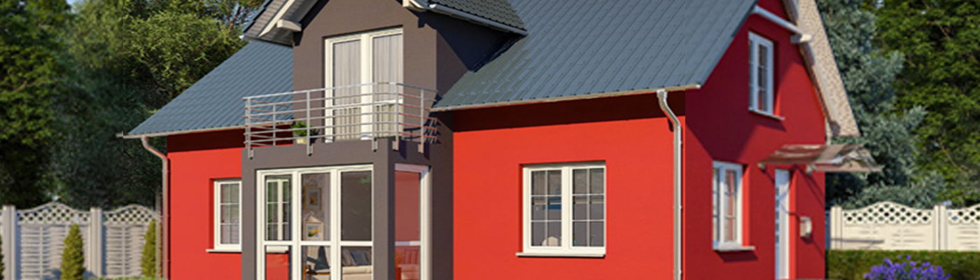 Ein rotes Haus mit grauem oberen Teil, großen Fenstern und einem kleinen Balkon.